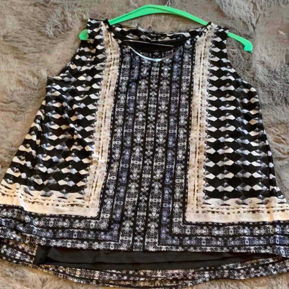 Black and cream sleeveless blouse